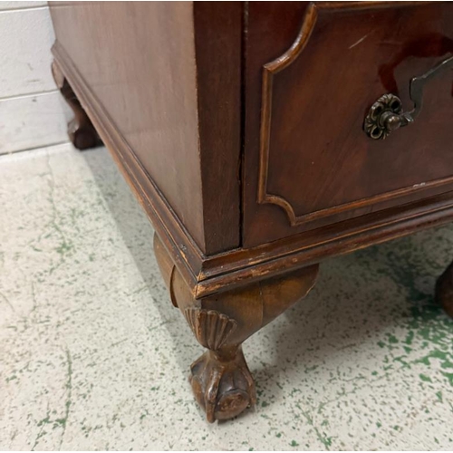 168 - A red leather topped pedestal desk, one long central drawer flanked by eight short drawers and on cl... 