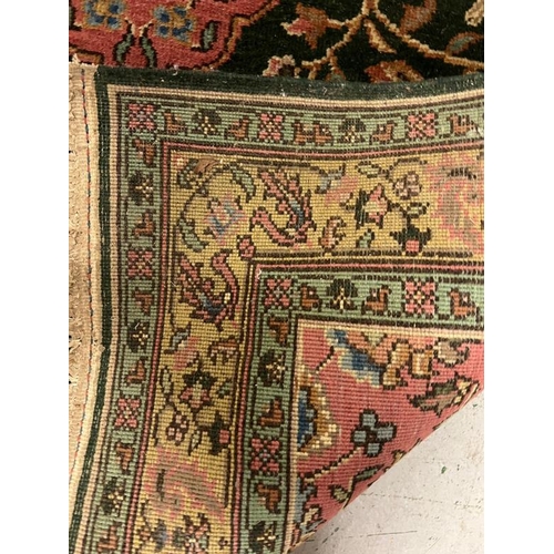 191 - A Persian rug with central medallion with lions and floral design, signed to one end 170cm x 122cm