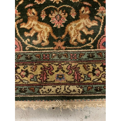 191 - A Persian rug with central medallion with lions and floral design, signed to one end 170cm x 122cm