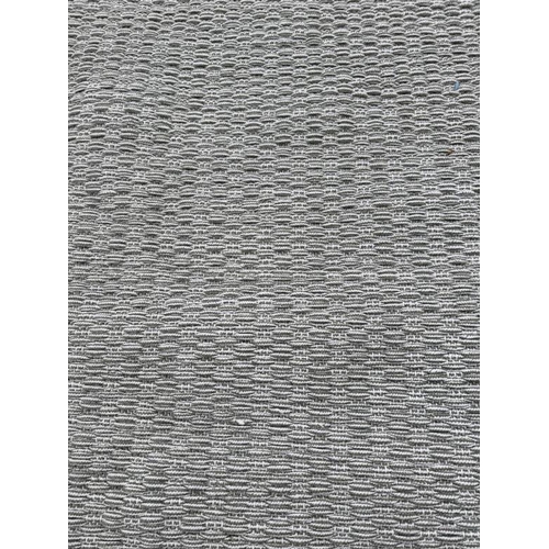 195 - A large contemporary rug in a pale green and white weave 352cm x 380cm