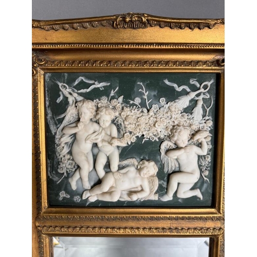 197 - A 20th Century neoclassical revival wall mirror having a ceramic panel to top featuring four putti w... 