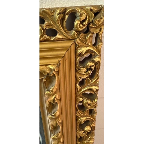 198 - A gold painted bevel edged mirror in the Rococo style 106cm x 67cm