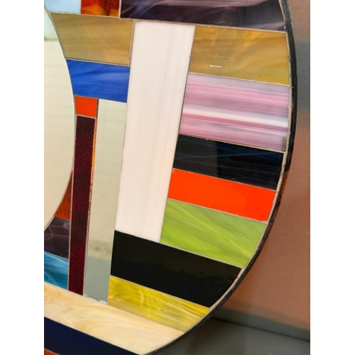 202 - A circular wall hanging mirror with a coloured glass and mirror mosaic (Dia 60cm)