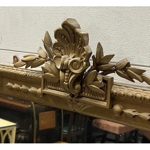 208 - A large carved over mantle mirror with garland folate scroll top