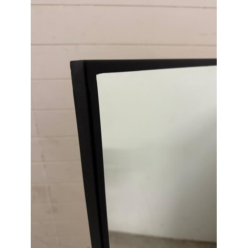 212 - A contemporary black metal framed wall mirror by Cotsworld Company 96cm x 120cm