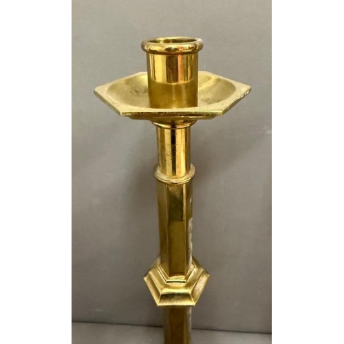 219 - A pair of church style brass candlesticks