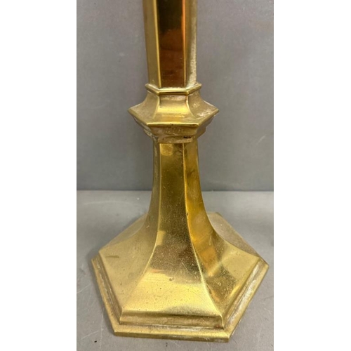 219 - A pair of church style brass candlesticks