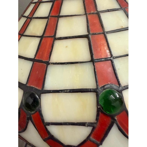 223 - An Art Deco style lamp with Tiffany style shade in white red and green stained glass