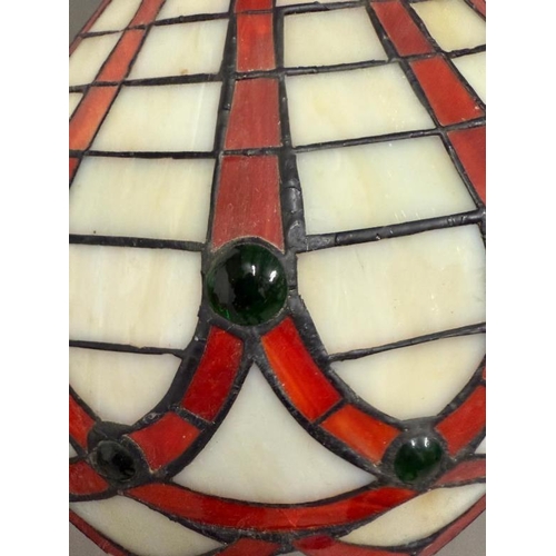 223 - An Art Deco style lamp with Tiffany style shade in white red and green stained glass