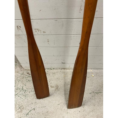 234 - A pair of antique wooden rowing oars