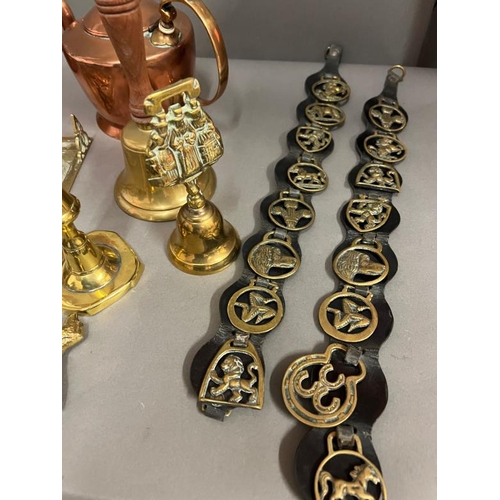 241 - A large collection of brass and copper to include hand bell and horse brass