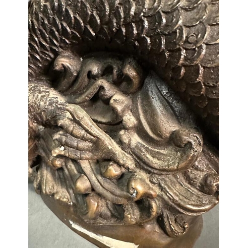 242 - A Chinese brass statue of the dragon god riding a dragon with bottle in hand and offering the sign o... 