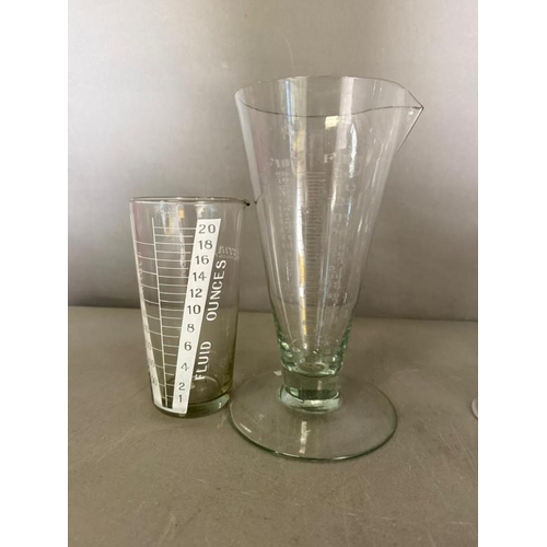 256 - A selection of etched glass measures of various sizes and ages