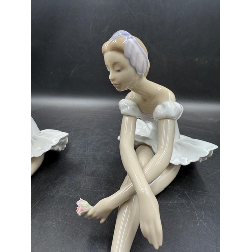 265 - Two Lladro figures of seated ballerinas