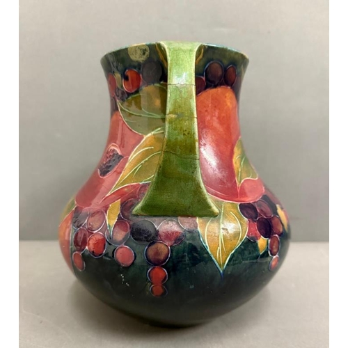 266 - A Moorcroft two handled Pomegranate vase signed to base (H22cm)