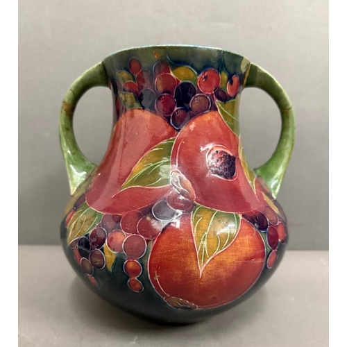 266 - A Moorcroft two handled Pomegranate vase signed to base (H22cm)