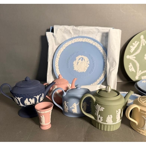 276 - A selection of Wedgwood Jasperware to include Christmas plates, miniature tea pots and pin dishes