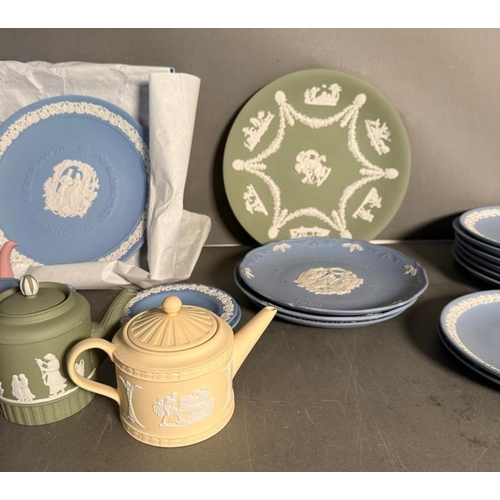 276 - A selection of Wedgwood Jasperware to include Christmas plates, miniature tea pots and pin dishes