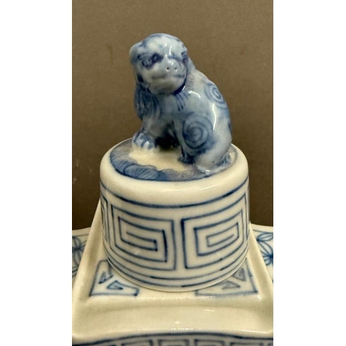 280 - Two ceramic Chinese blue and white tea caddies with foo dogs to lids