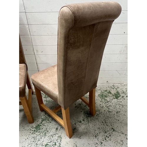 30 - Two dining tan leather chairs