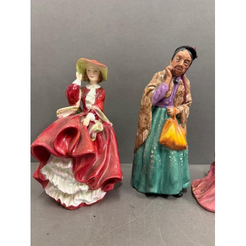 309 - Four Royal Doulton figures to include Top Of The Hill, Bridget, Linda and Christmas Morning