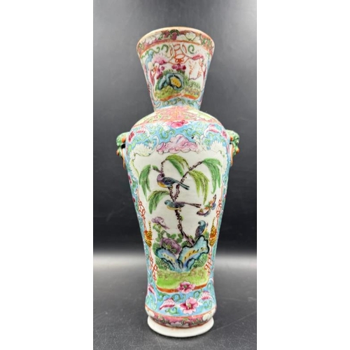 310 - A Chinese famile rose vase featuring birds, flowers and trees (H25cm)