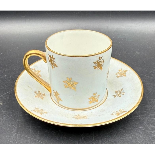 312 - Two Limoges coffee cups and saucers, blue grounds with gilt floral patterns