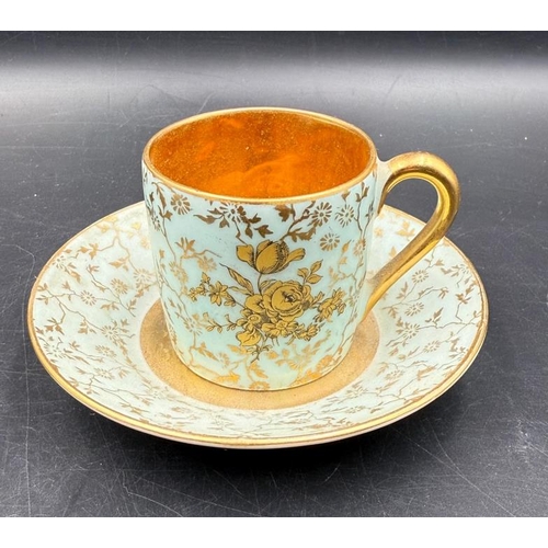 312 - Two Limoges coffee cups and saucers, blue grounds with gilt floral patterns