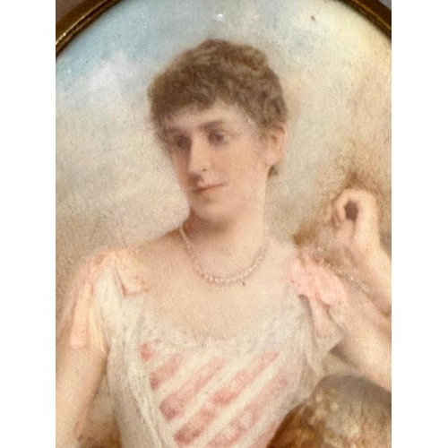 347 - A 19th Century watercolour miniature portrait of a lady in a brass frame