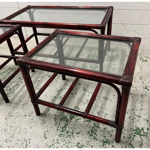 35 - A dark bamboo style glass coffee table and two side tables