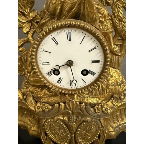 374 - A 19th Century French gilt mantel clock in a glass dome and on plinth, an eight day movement with en... 