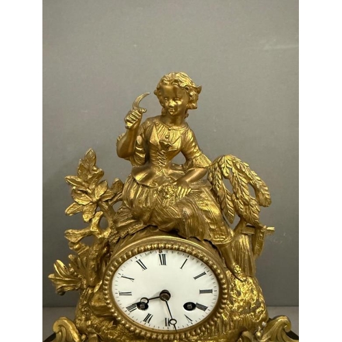 374 - A 19th Century French gilt mantel clock in a glass dome and on plinth, an eight day movement with en... 