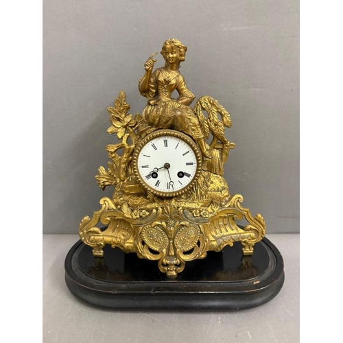 374 - A 19th Century French gilt mantel clock in a glass dome and on plinth, an eight day movement with en... 