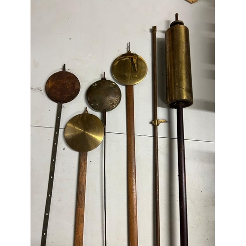 383 - A collection of pendulums and orb weights, English, German and regulator