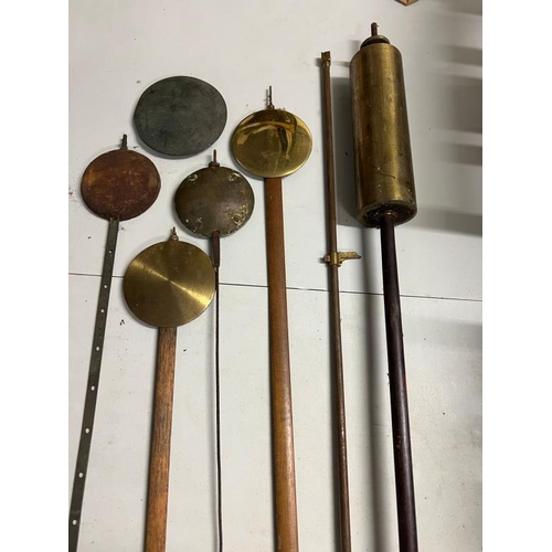 383 - A collection of pendulums and orb weights, English, German and regulator