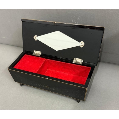 396 - A Mid Century musical jewellery box with internal diamond shaped mirror