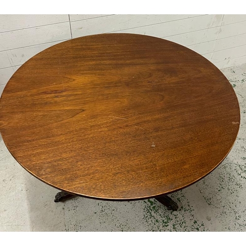 4 - A Regency style circular centre table on turned column stem raised on down swept legs and lion paw c... 