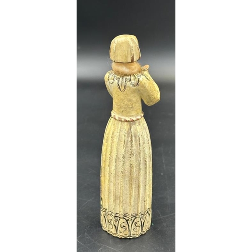 411 - An 18th Century carved reliquary figure of a lady praying, her skirts open to show a lady kneeling i... 