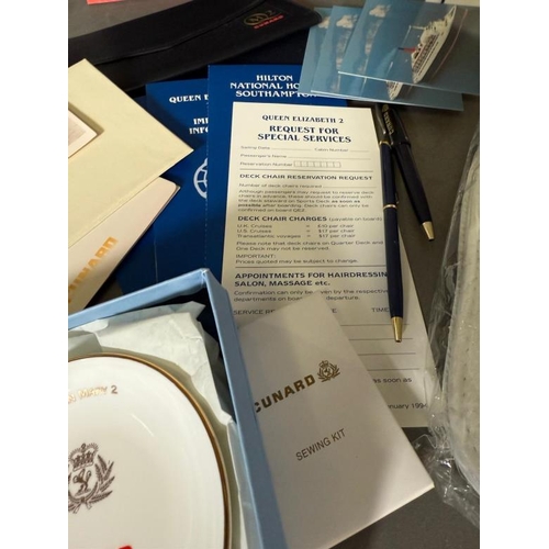 435G - A large quantity of Cunard line collectables to include QE2 brochures caps and stationary and a Wedg... 