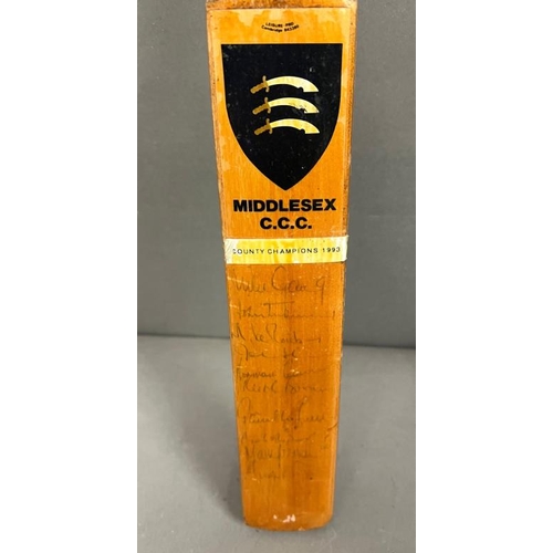 435 - A signed mini cricket bat, Middlesex C.C.C Country Champions 1993