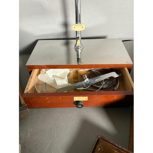 444 - A selection of vintage pharmaceutical equipment to include scales and weights