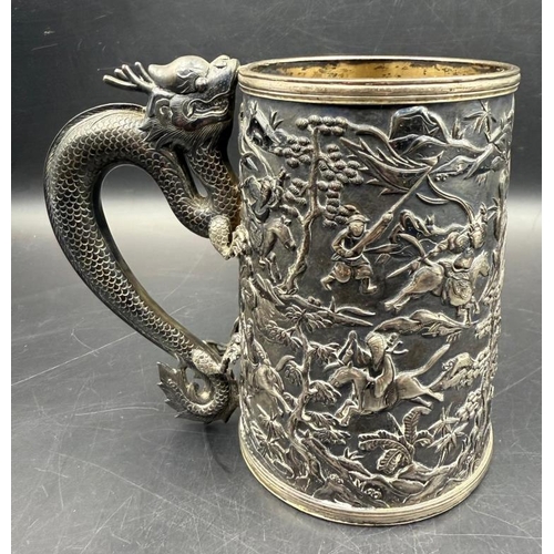 456 - A 19th Century silver Chinese Export Beer tankard with dragon handle and warrior themed engraving, h... 