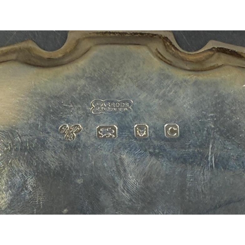 468 - A Harrods silver tray on four feet with scalloped edge and engraved to base, Hallmarked for London 1... 