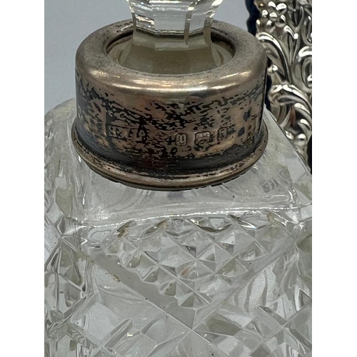 471 - A silver necked scent bottle along with a small, 9.5cm H, easel backed hallmarked picture frame and ... 