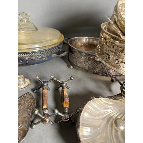 478 - A quantity of silver plate and white metal items to include serving dish, kettle and a candelabra