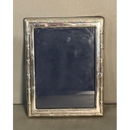 516 - Three photograph frames; Wedgwood glass eaglet backed frame, Tiffany & Co frame and a silver frame m... 