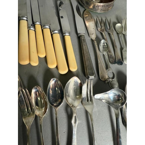 518 - A selection of silver plate and white metal flatware and other items