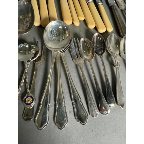 518 - A selection of silver plate and white metal flatware and other items