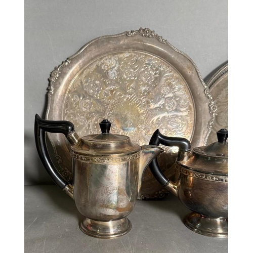 524 - A selection of silver plate and white metal items to include trays, tea pot and a Harrords tea strai... 