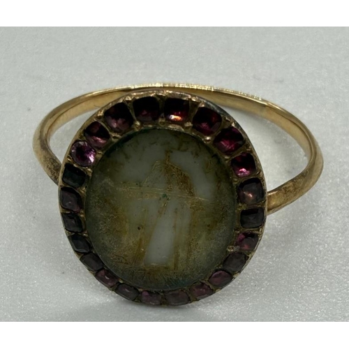 528 - An English 18th century gold and ruby morning ring and a 19th century gold and carnelian ring